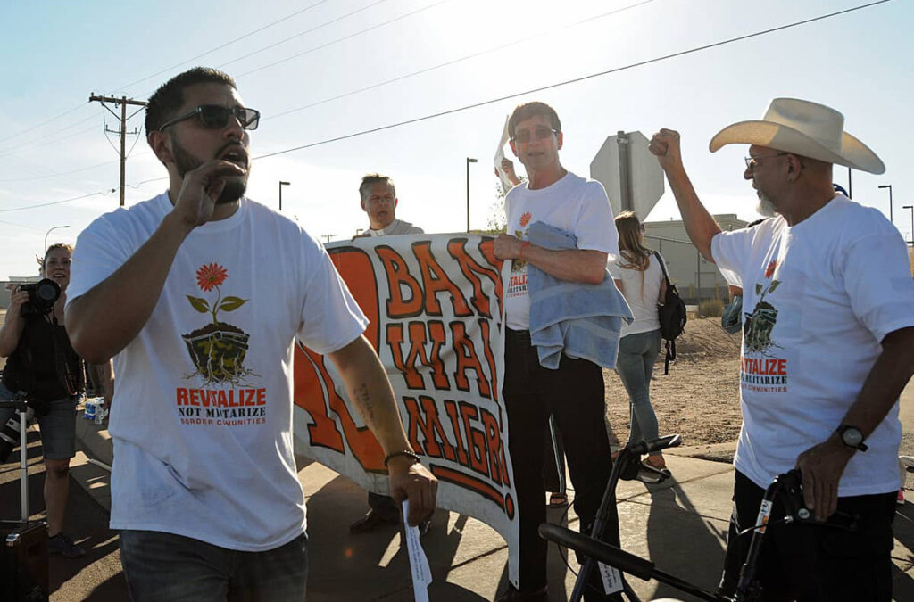 Community organizer Allex Luna leading a chant during a protest at the U.S. Border Patrol station in Las Cruces in May 2017.