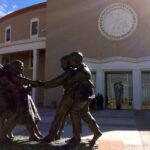 A statue of children outside the Roundhouse in Santa Fe.