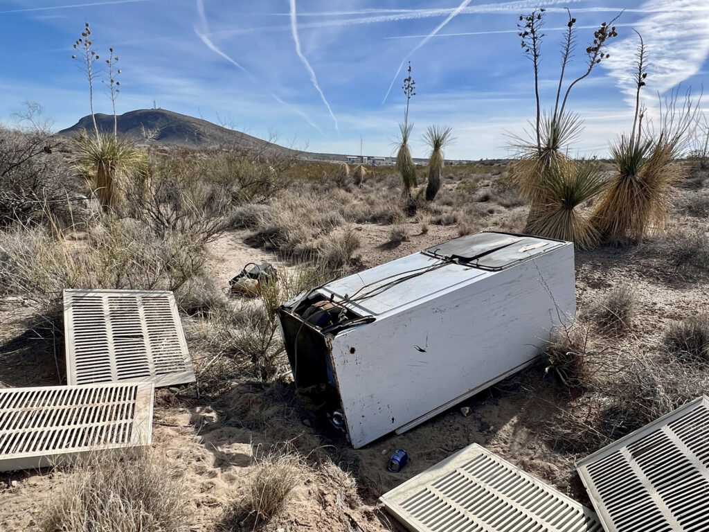 A refrigerator and other trash I found illegally dumped while I was hiking.