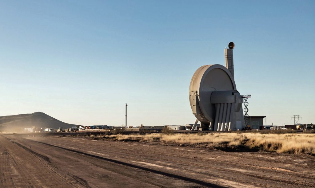 SpinLaunch is developing a launch system that uses kinetic energy with a vacuum-sealed centrifuge to spin a projectile at several times the speed of sound before releasing. The rocket launch company has constructed a 150-foot-tall suborbital accelerator at Spaceport America. (Spaceport America photo)